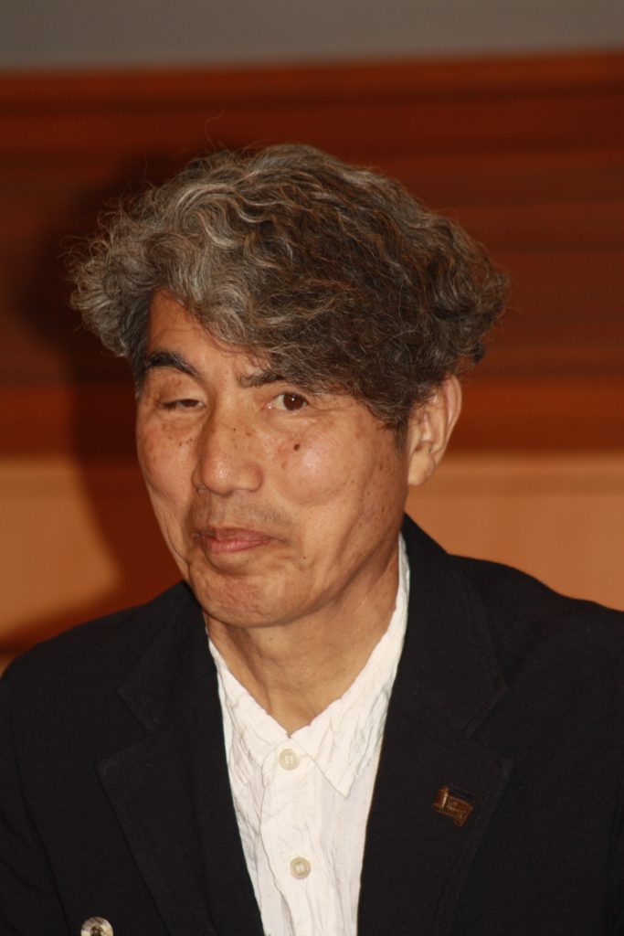 Filmmaker and Professor Kohei Ando answers questions at the conference